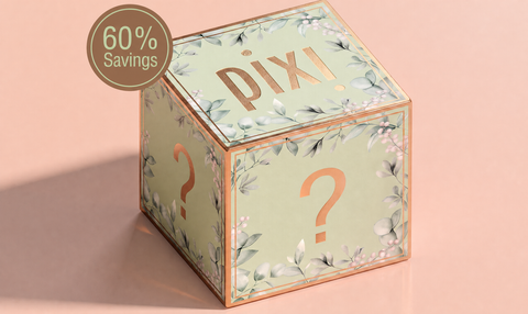 A decorative cube-shaped Pixi gift box with a floral print, rose gold trim, a large question mark on the front, and a '60% Savings' badge overlay, set against a soft peach background.