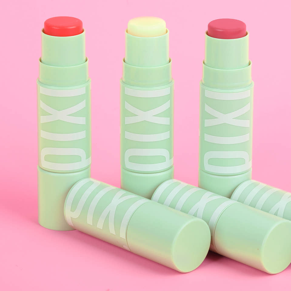 +Hydra LipTreat three product shades shown on pink background - additional product shown in the image to feature the cap on version. view 2