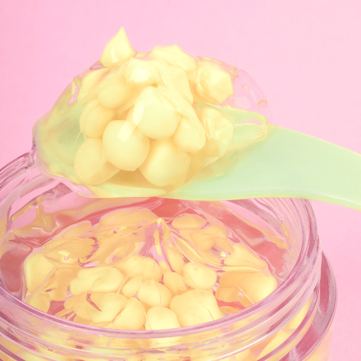 Vitamin C capsules suspended in hydrating hyaluronic gel