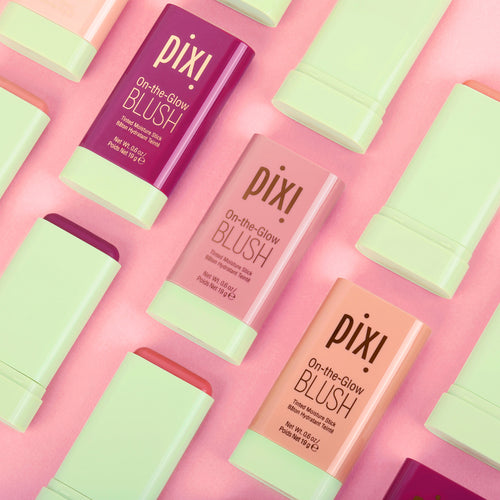 3 shades of On-the-Glow Blush shown with open lids on a pink background