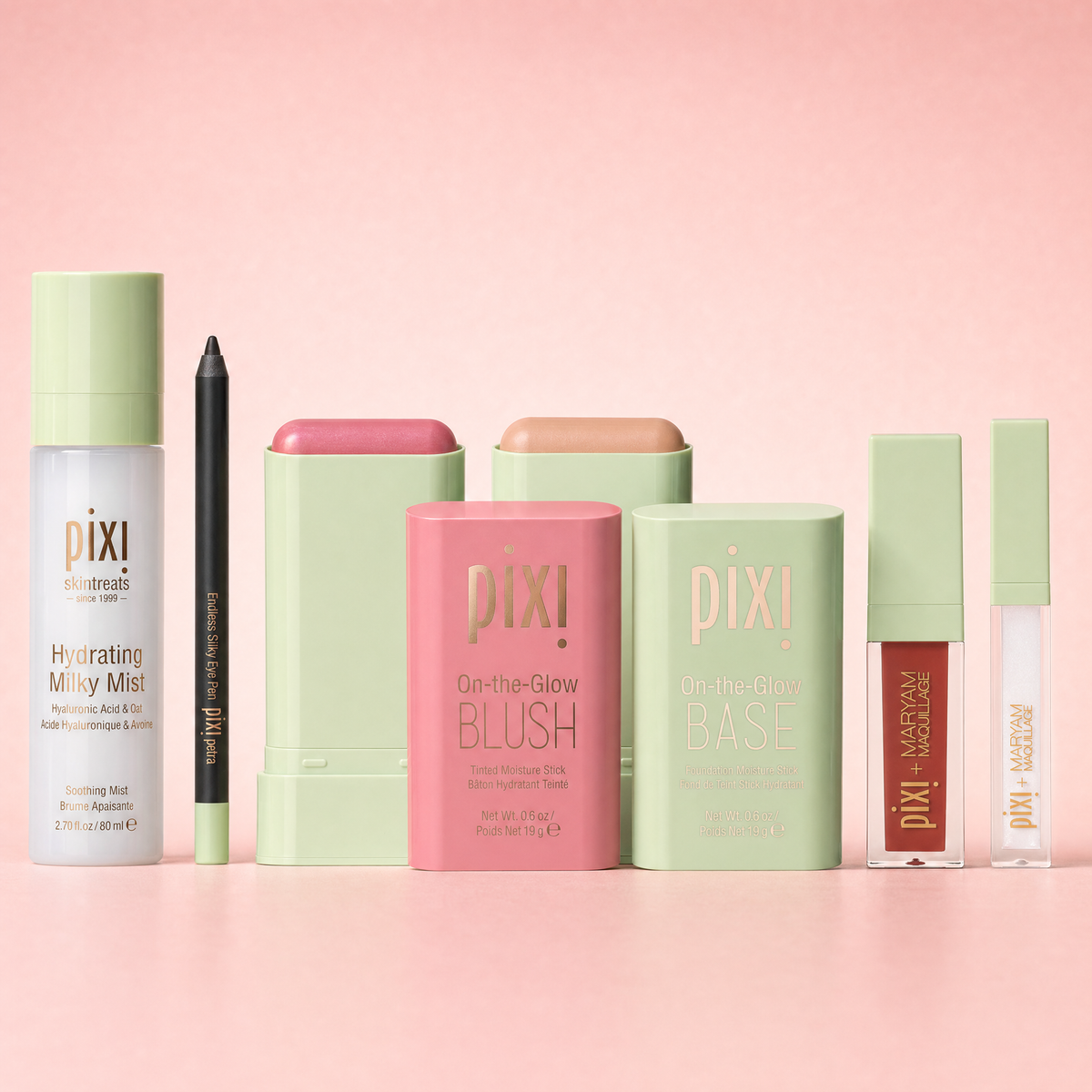 Bundle shown on a pink background featuring Hydrating Milky Mist, Endless Silky Eye Pen, On-the-Glow BLUSH, On-the-Glow BASE, and Pixi + Maryam Lip and Highlight duo